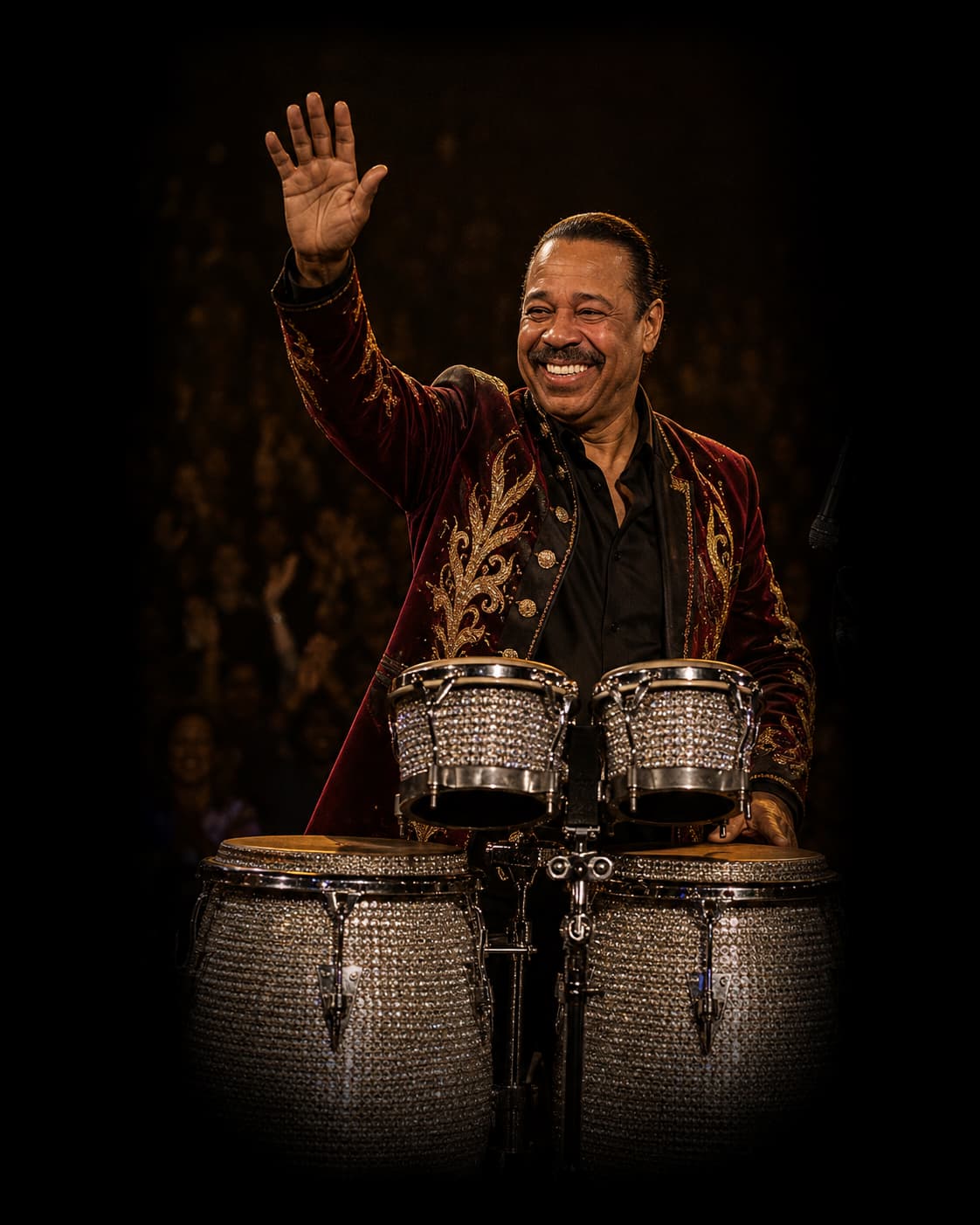 Victor Orlando waving to the audience from behind his percussion instruments